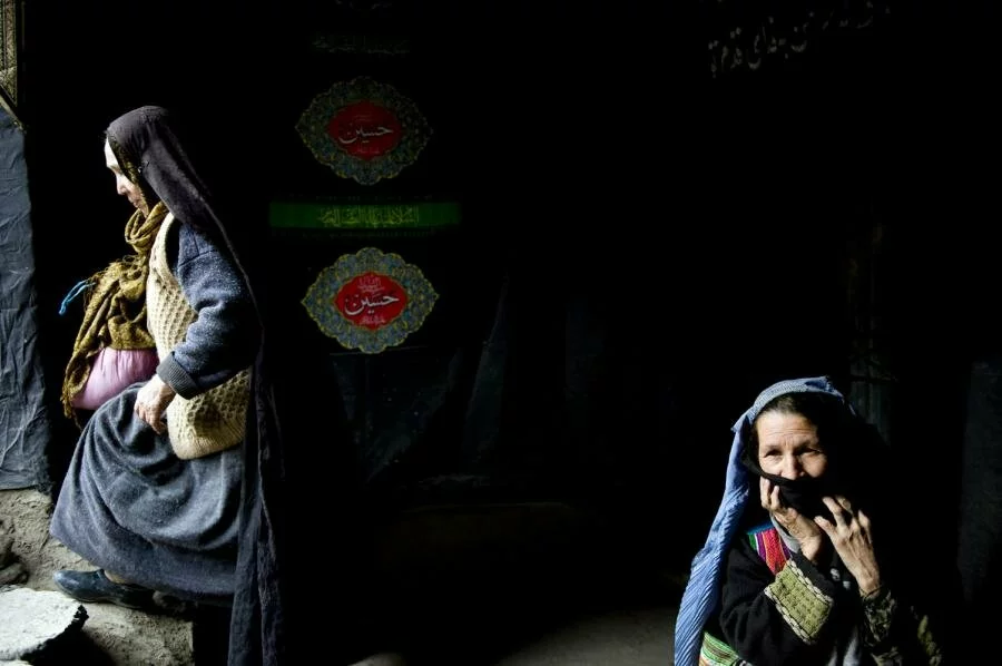 Afghan women sits at the entrance to a Shiite mosque after she received food during Ashura in the streets of Kabul Afghan women sits at the entrance to a Shiite mosque after she received food during Ashura in the streets of Kabul Afghan women sits at the entrance to a Shiite mosque after she received food during Ashura in the streets of Kabul