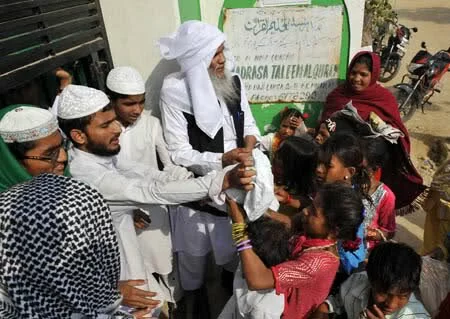 Muslims distribute mutton to the poor in surrounding slums at a mosque in New Delhi capital of India Muslims in India celebrated the traditional Islamic feast of Eid al Adha 